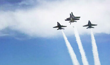 Blue Angels flying trail in clouds