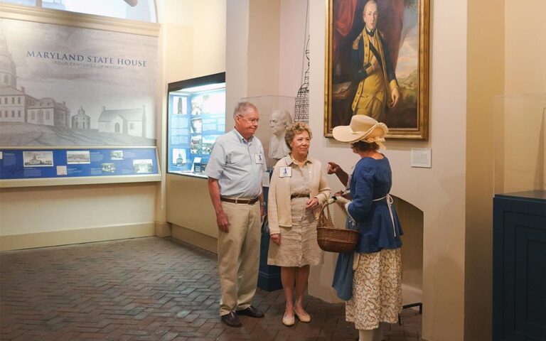 Watermark's tour guide points out Lafayette's portrait that hangs in the Maryland State House to commemorate his connection to the state.